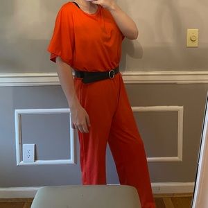 Bright orange jumpsuit does not include belt